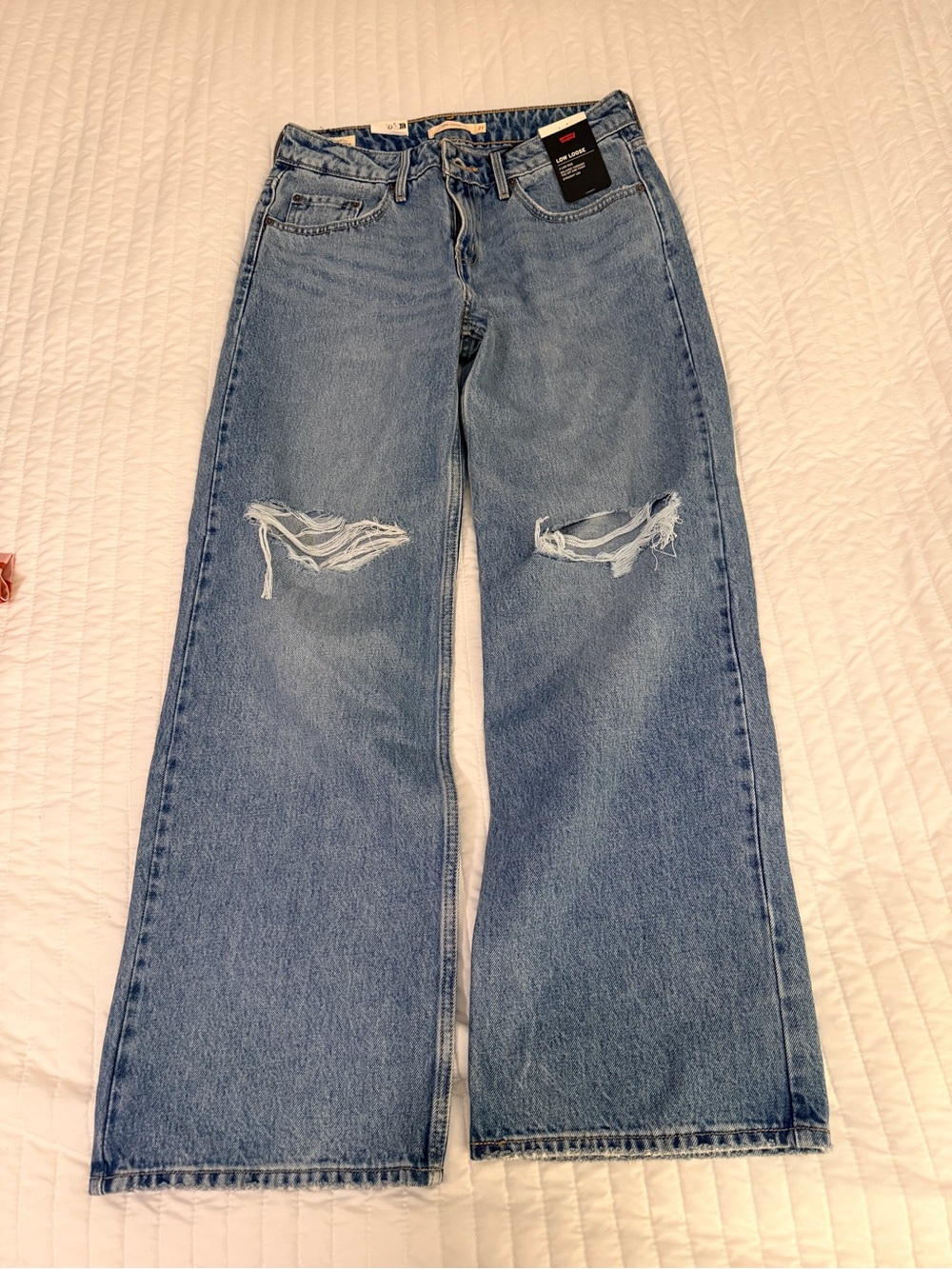 Levi's Women's Light Blue Flared Distressed Jeans. Low Loose Jean 27x30